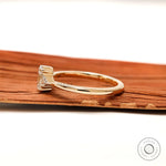 Delicate three stone oval lab grown diamond ring polished band