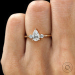Yellow gold trilogy ring delicate prong setting on finger