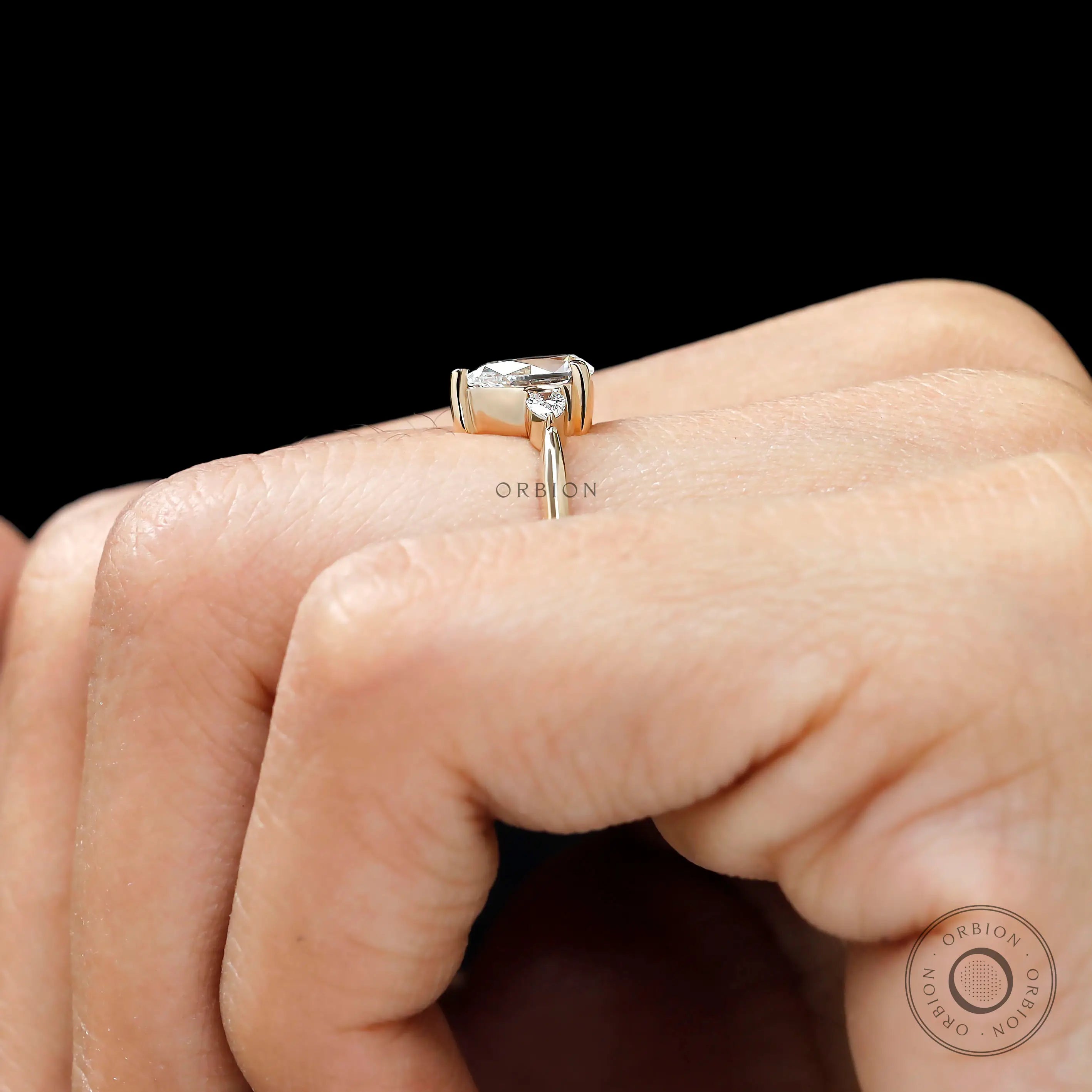 Lab grown diamond pear engagement ring with delicate setting