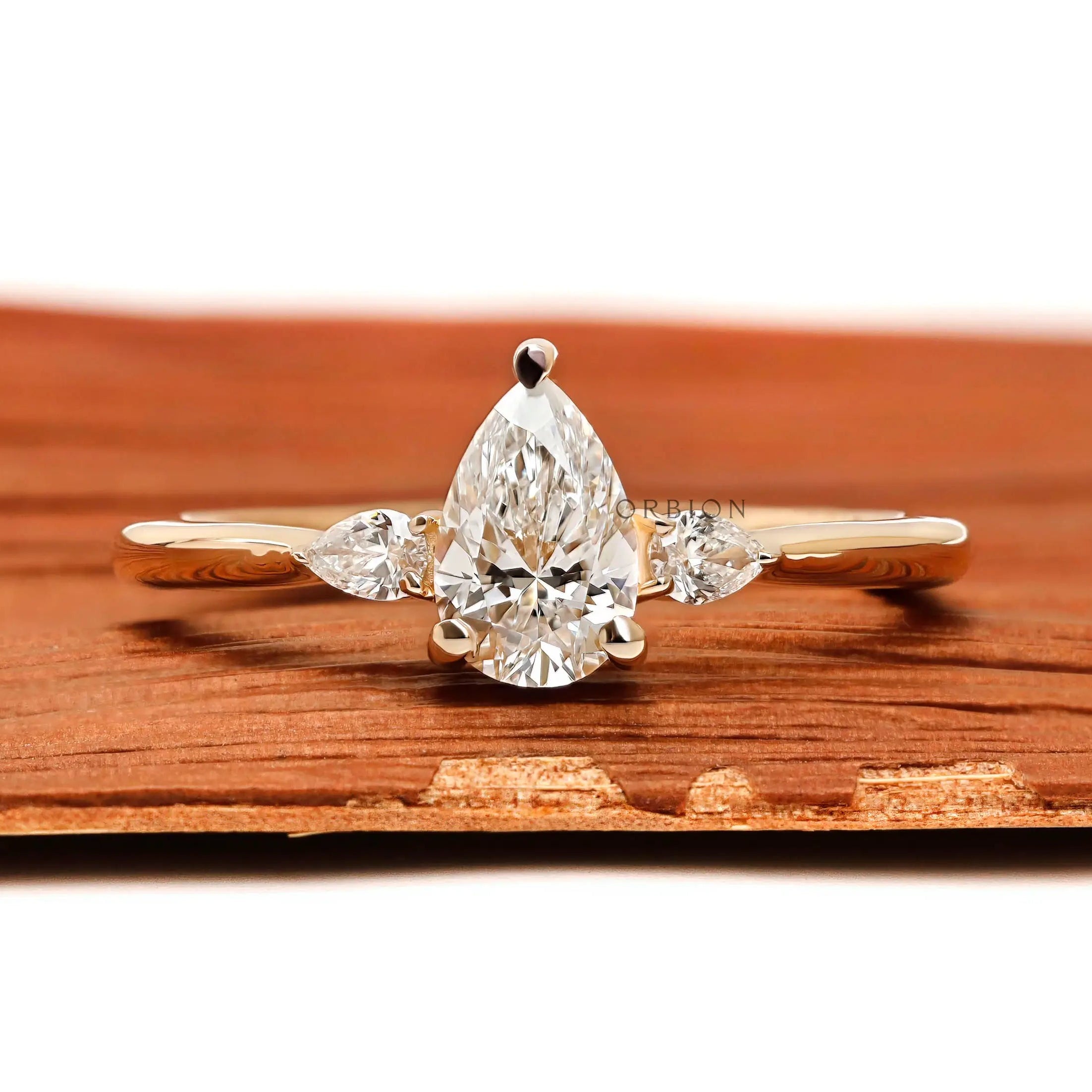 Pear cut three stone lab diamond engagement ring in 10K yellow gold