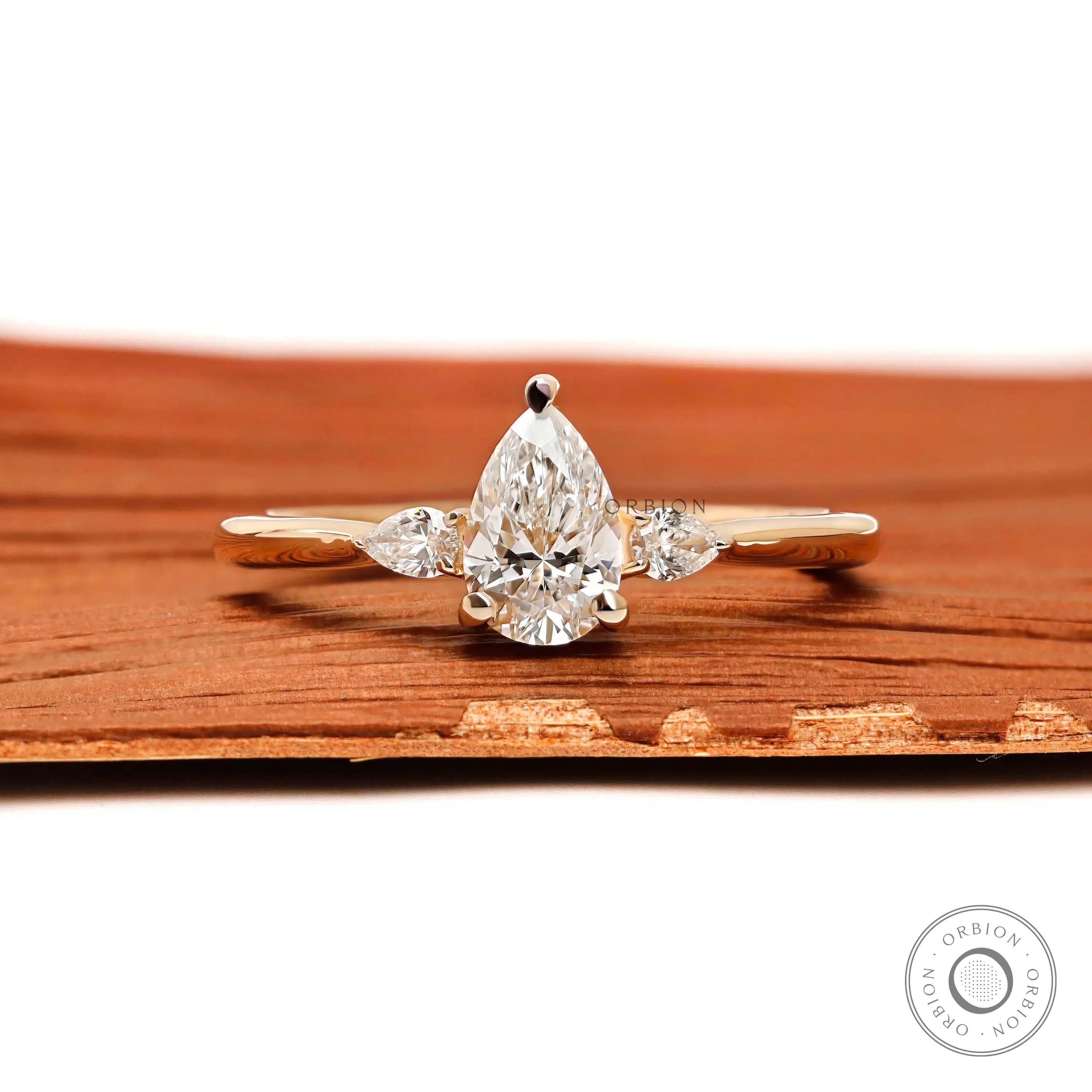 Pear cut three stone lab diamond engagement ring in 10K yellow gold