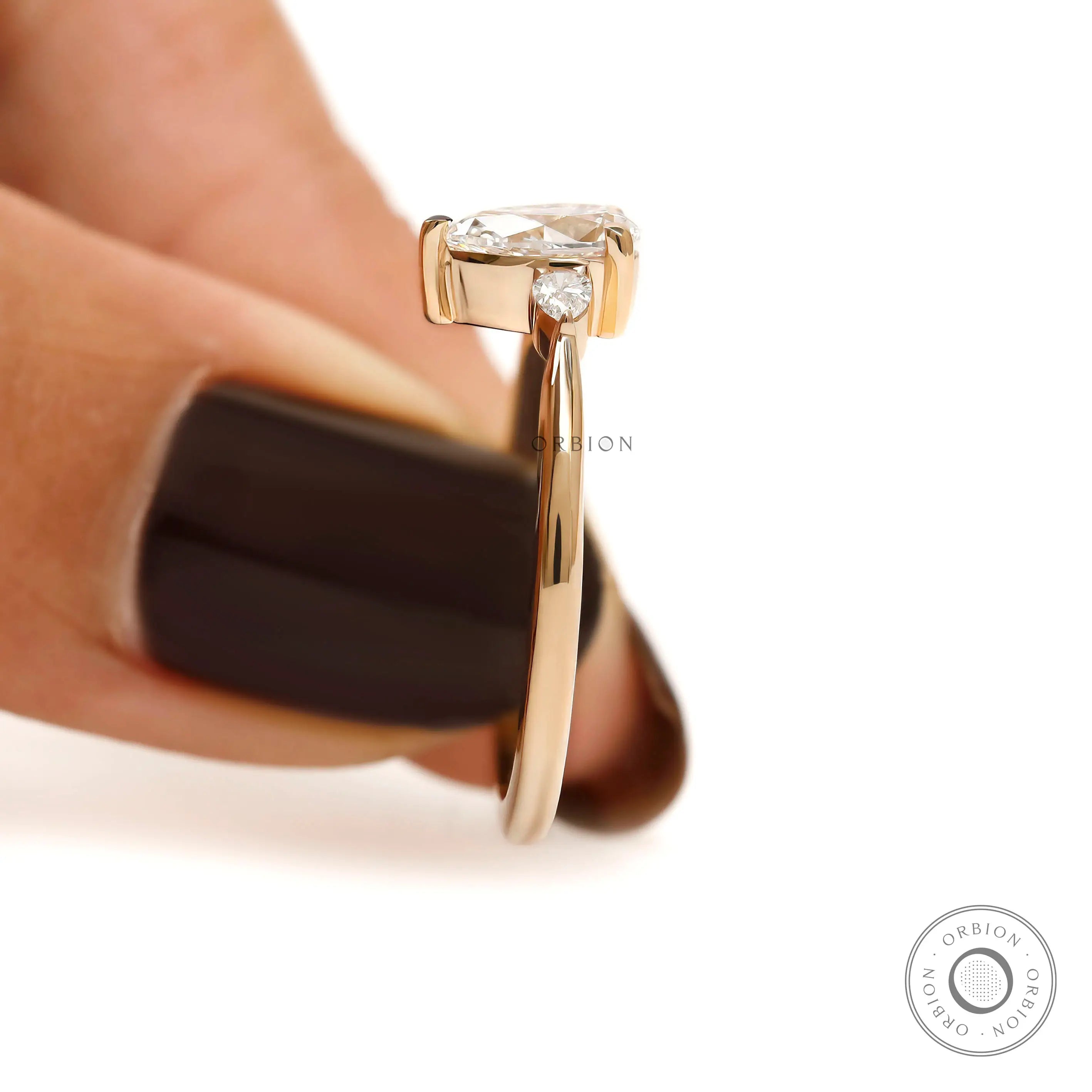 Fine jewelry pear cut ring with polished yellow gold band