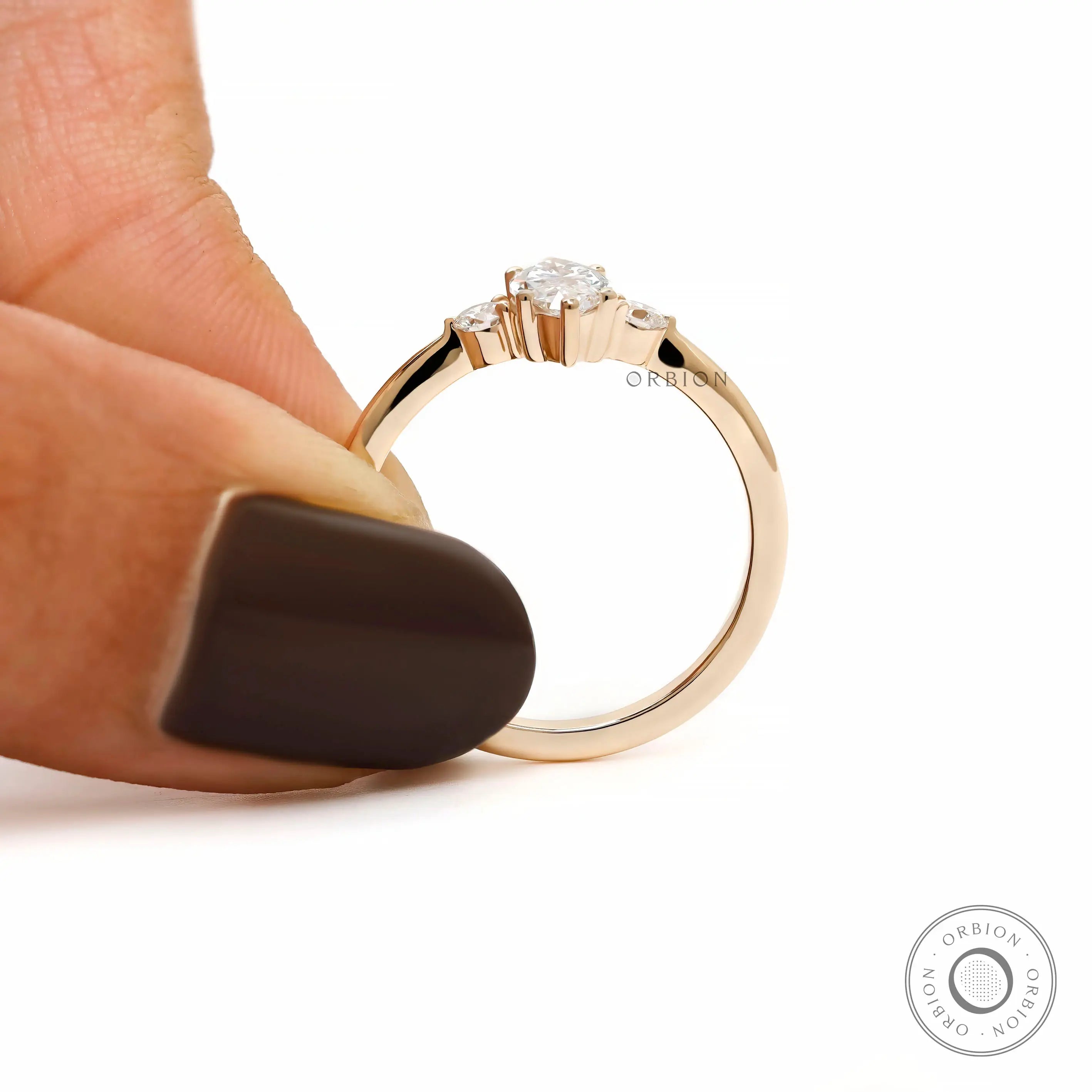 Minimalist three stone engagement ring marquise and round diamonds
