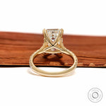 lab diamond emerald cut solitaire ring with split shank and pave detailing, 10k yellow gold