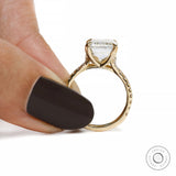 solitaire emerald cut moissanite ring with pave cathedral in 10k yellow gold