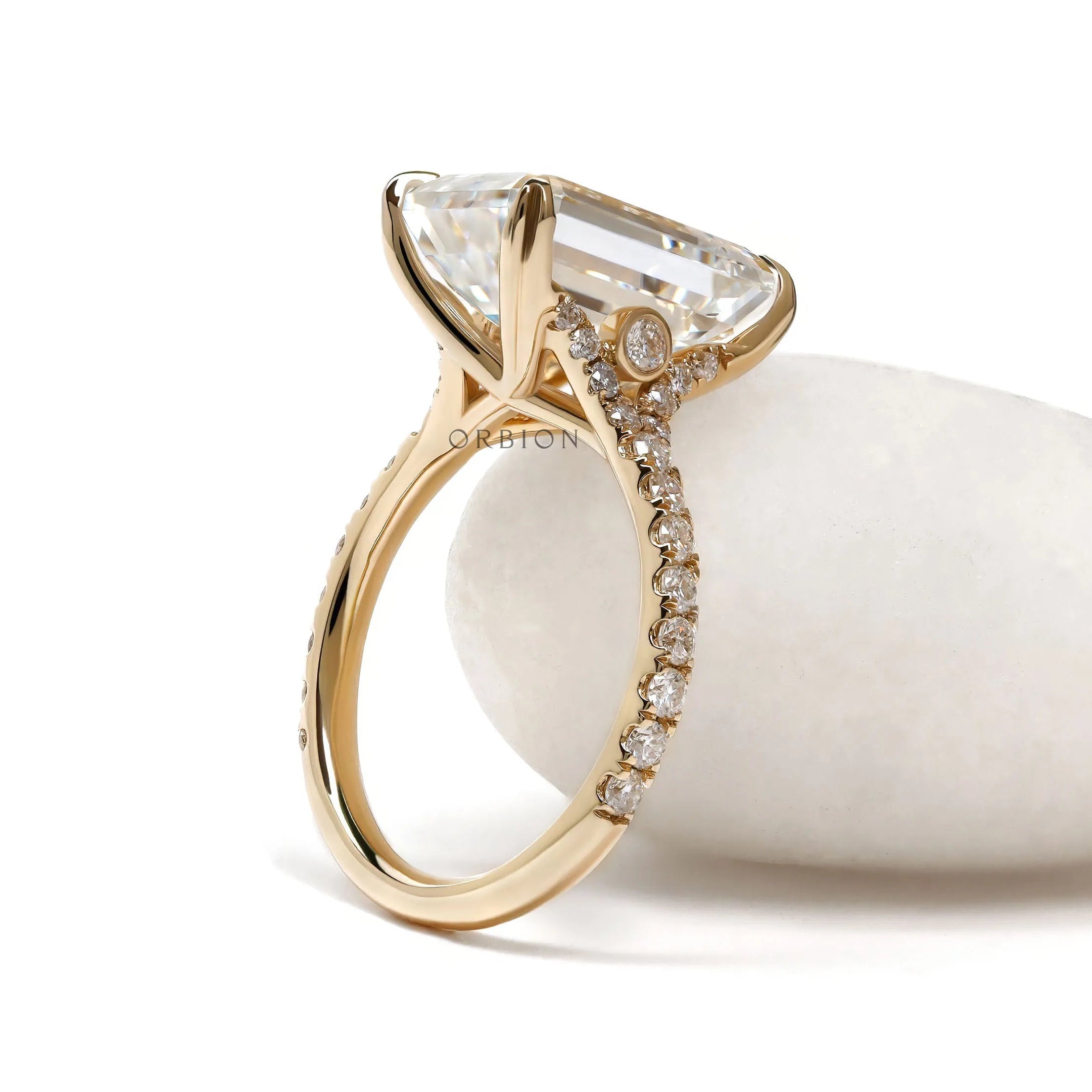 Yellow gold engagement ring with emerald cut 4.5 ct moissanite