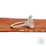 Elegant 4.5 ct emerald cut moissanite engagement ring with pave split shank in yellow gold