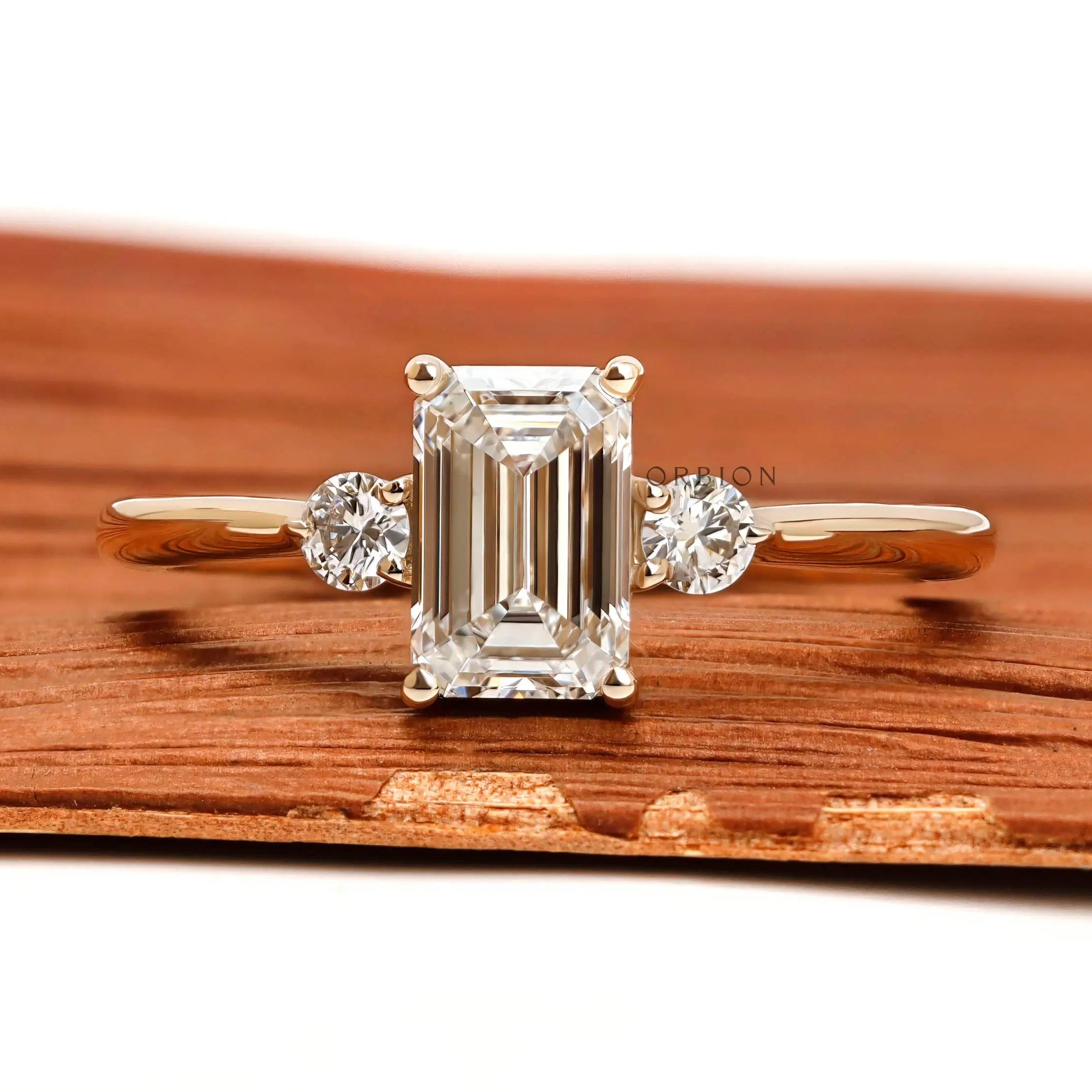 Emerald cut three stone lab diamond ring in 10k yellow gold front view
