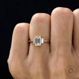 Dainty three stone engagement ring glossy yellow gold finish