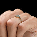 Minimal three stone emerald cut engagement ring yellow gold