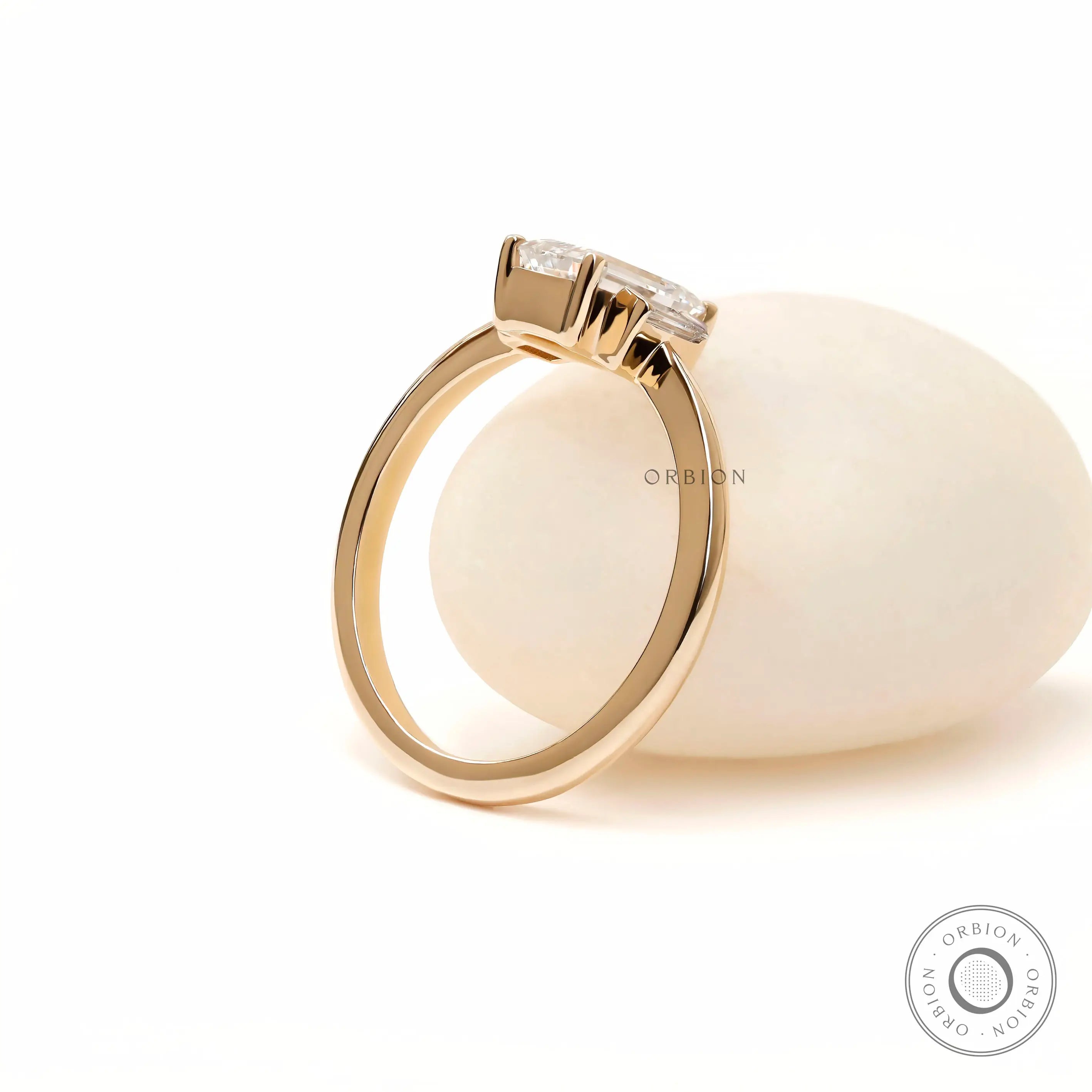 Bar set baguette side stone engagement ring slim band