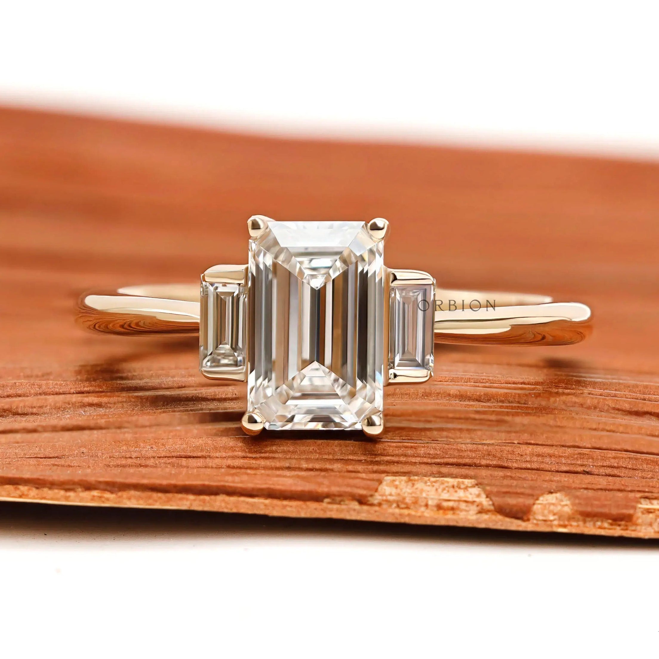 Dainty emerald cut lab diamond ring with bar set baguette side stones