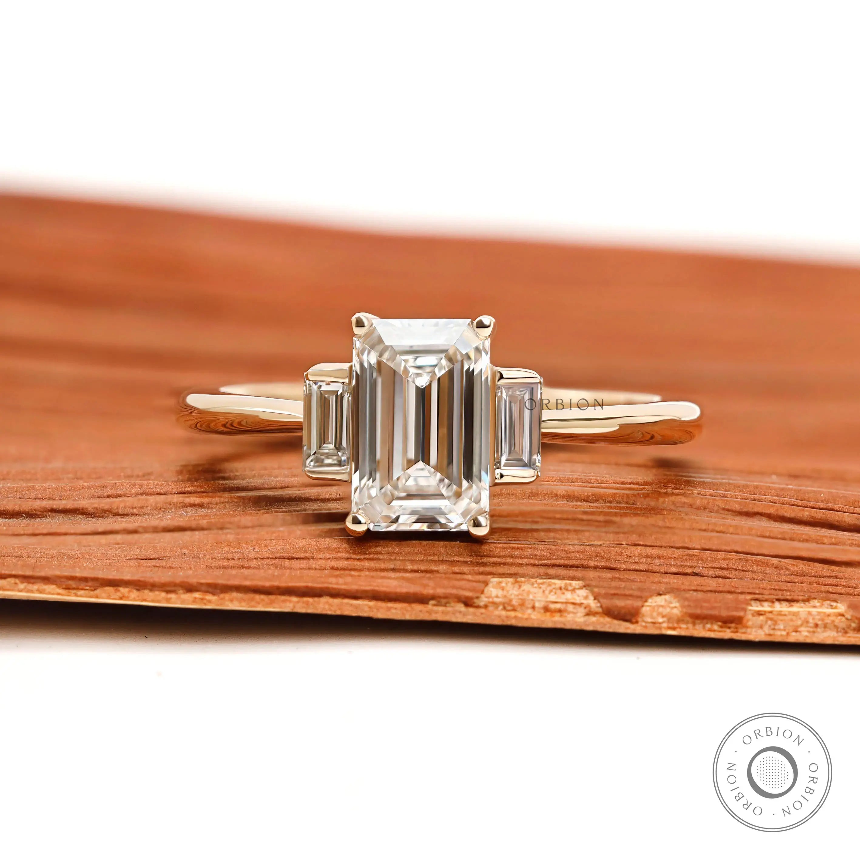 Dainty emerald cut lab diamond ring with bar set baguette side stones