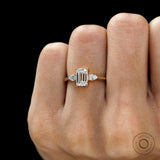 Elegant 3 stone lab diamond engagement ring with emerald and pear stones