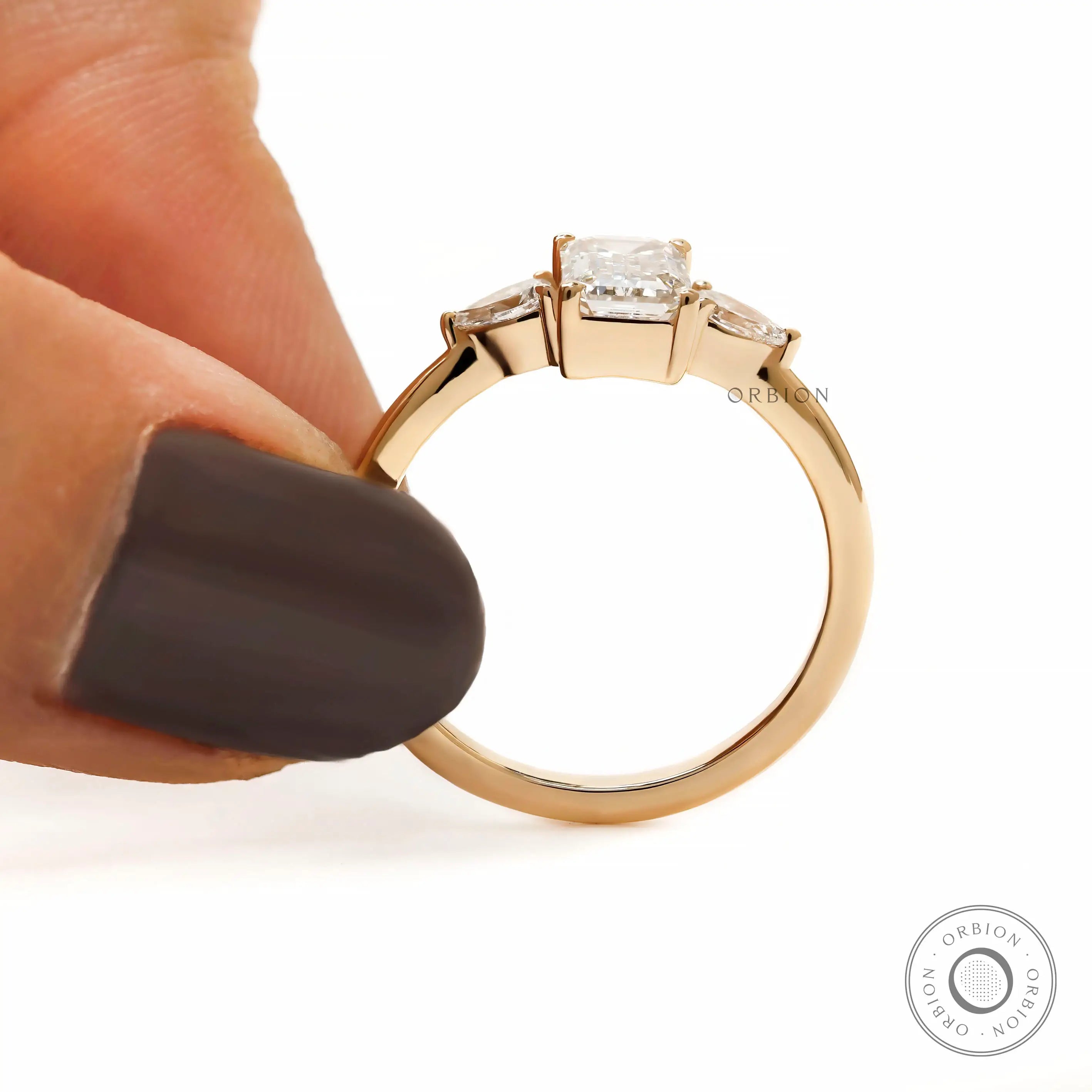Elegant lab diamond engagement ring with emerald and pear stones