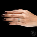 Trillion side stone detailing on three stone engagement ring