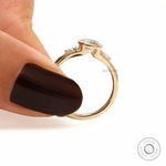 Modern floating engagement ring with bezel and prong stone setting