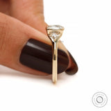 Trillion side stone detailing on three stone engagement ring