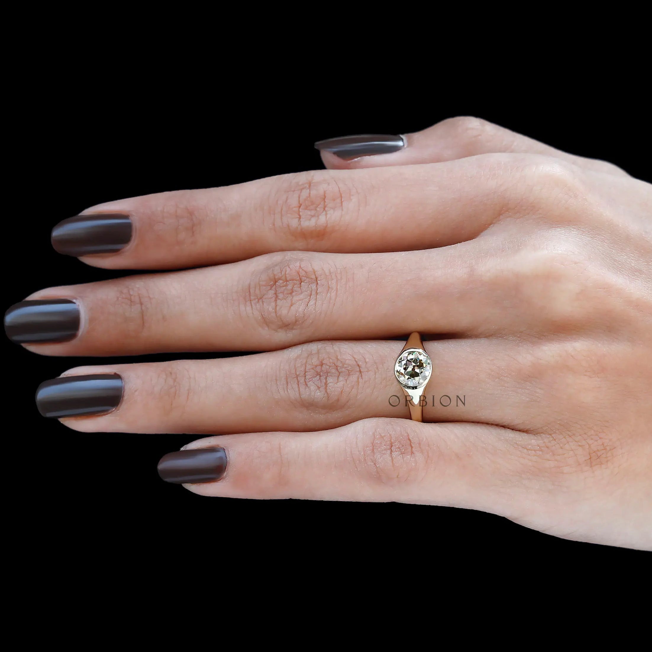 Polished 14k yellow gold bezel set champagne stone ring
