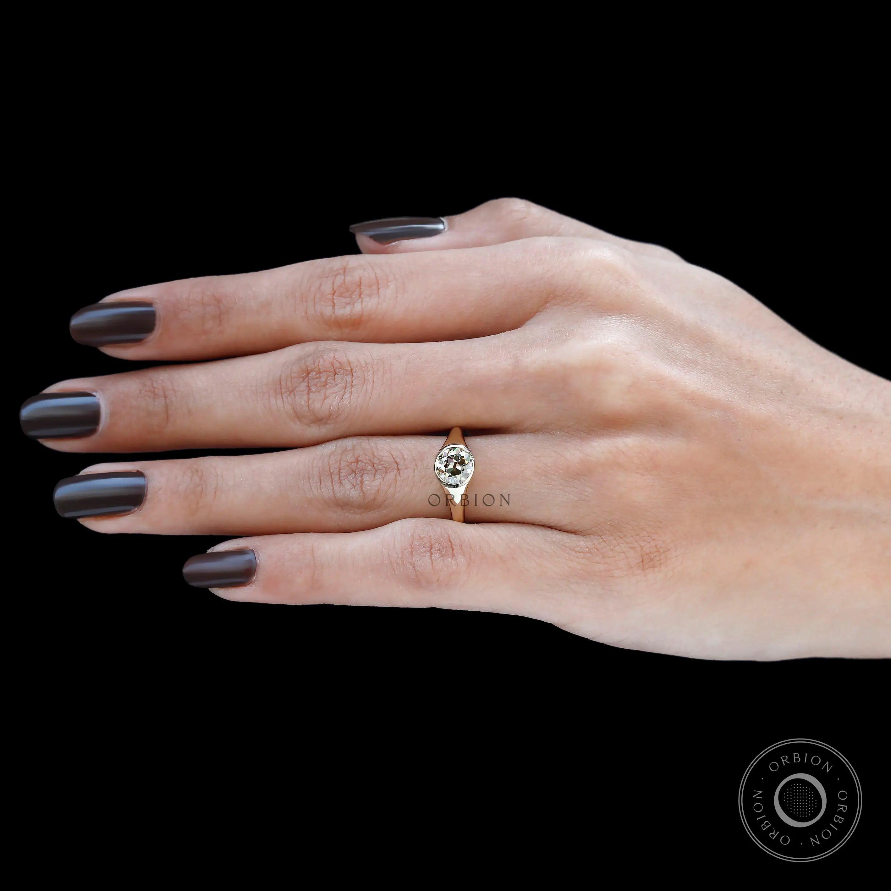 Polished 14k yellow gold bezel set champagne stone ring