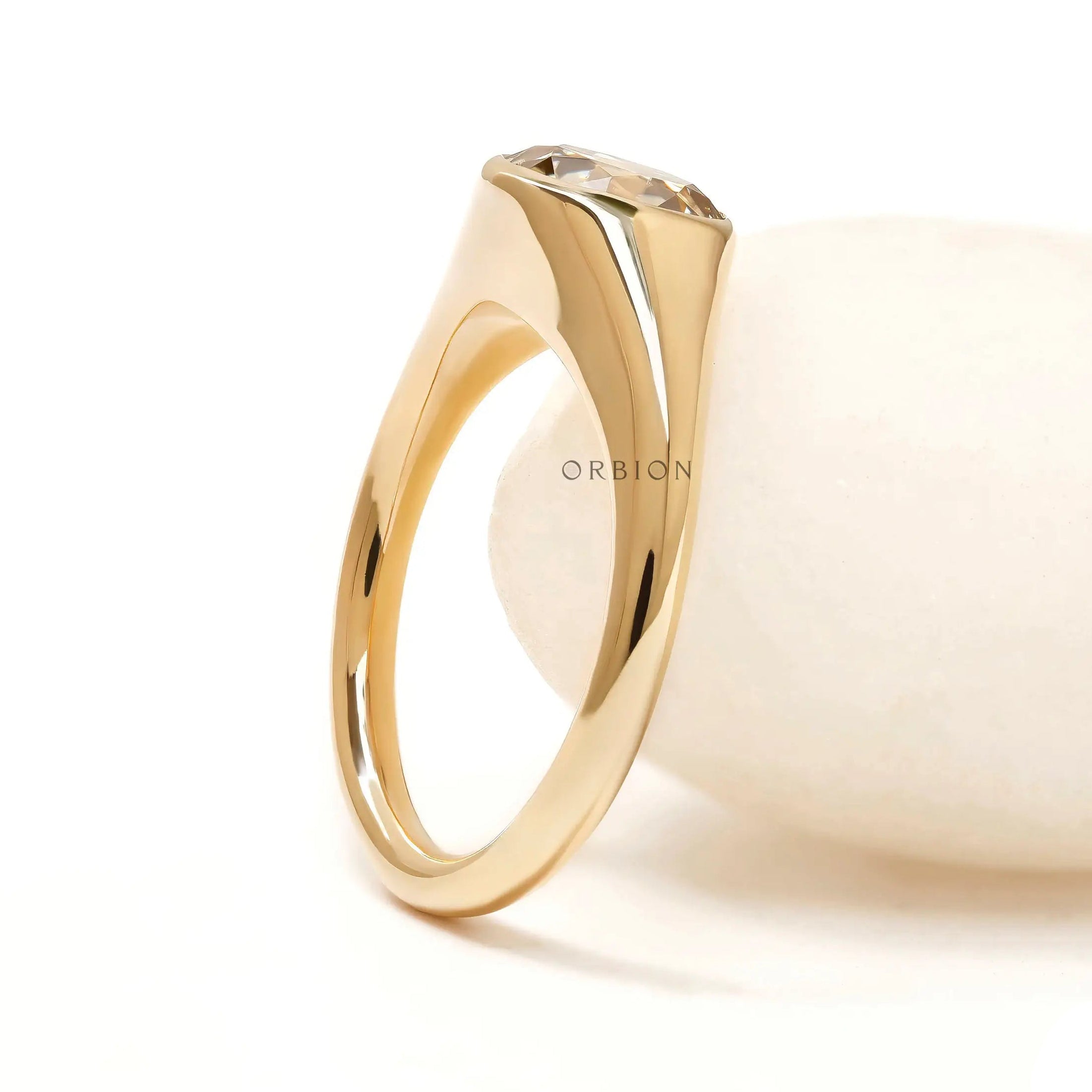 Women’s yellow gold signet ring with round champagne moissanite