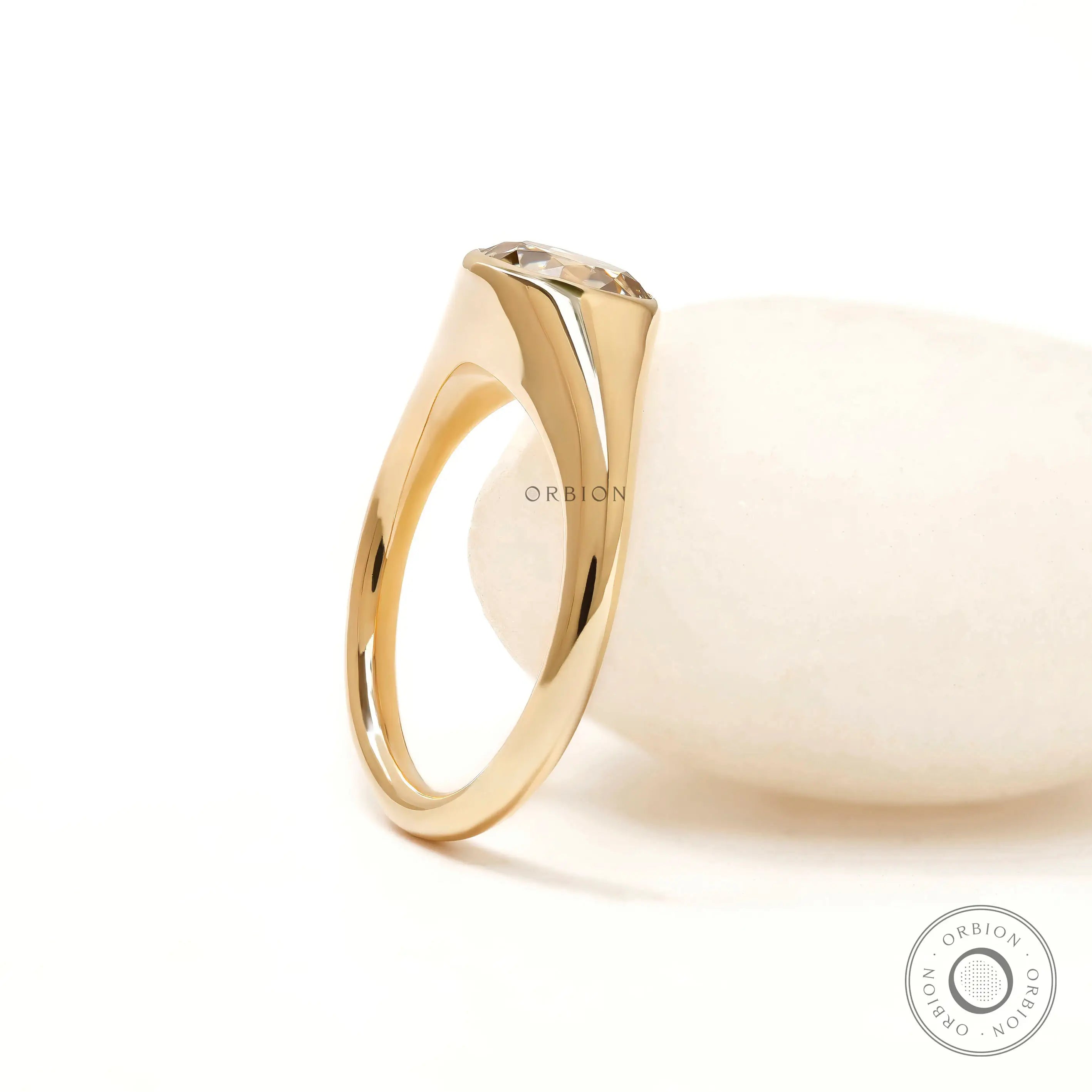 Women’s yellow gold signet ring with round champagne moissanite