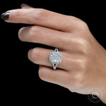 Elegant cushion cut engagement ring with classic halo setting