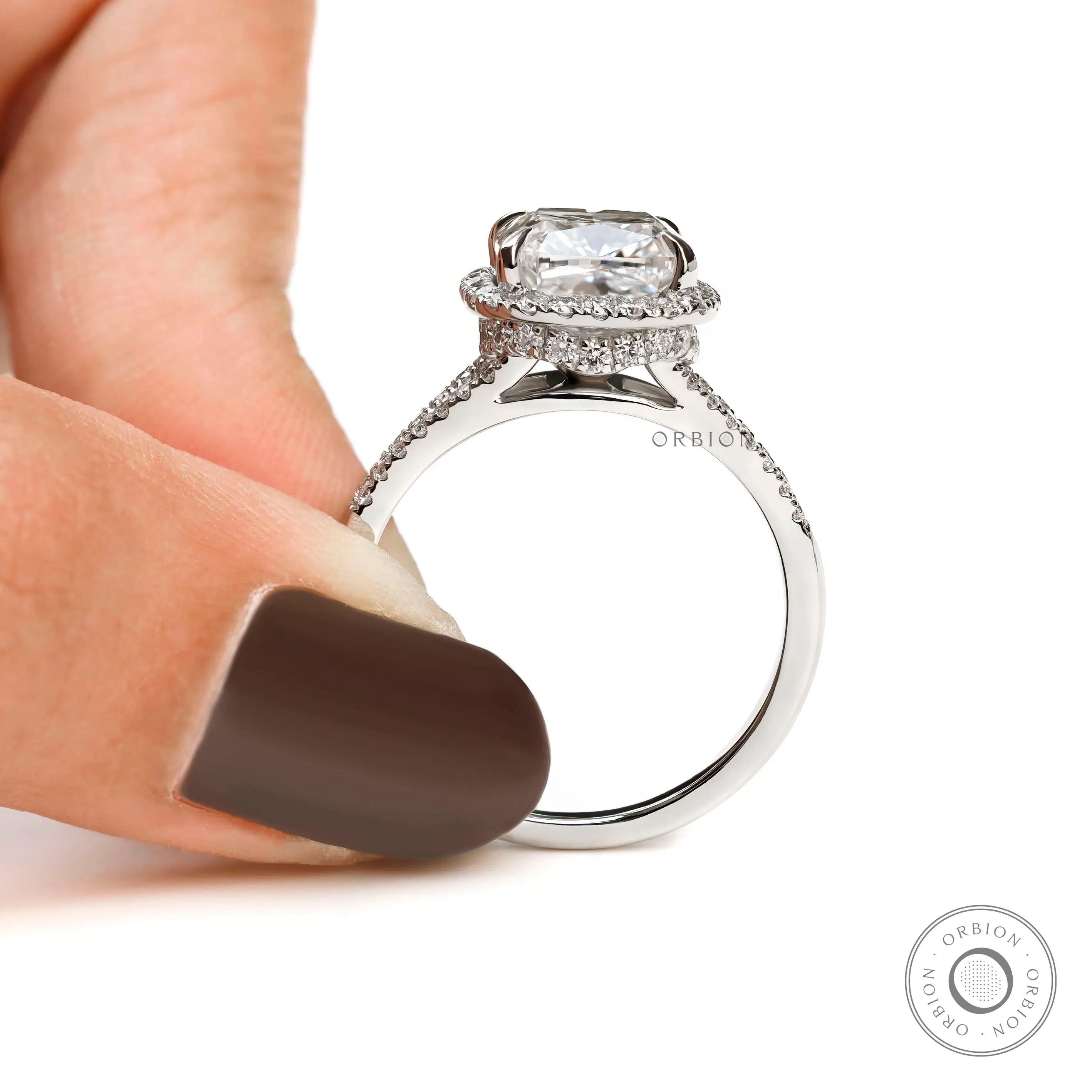 Platinum halo engagement ring with pave diamond band
