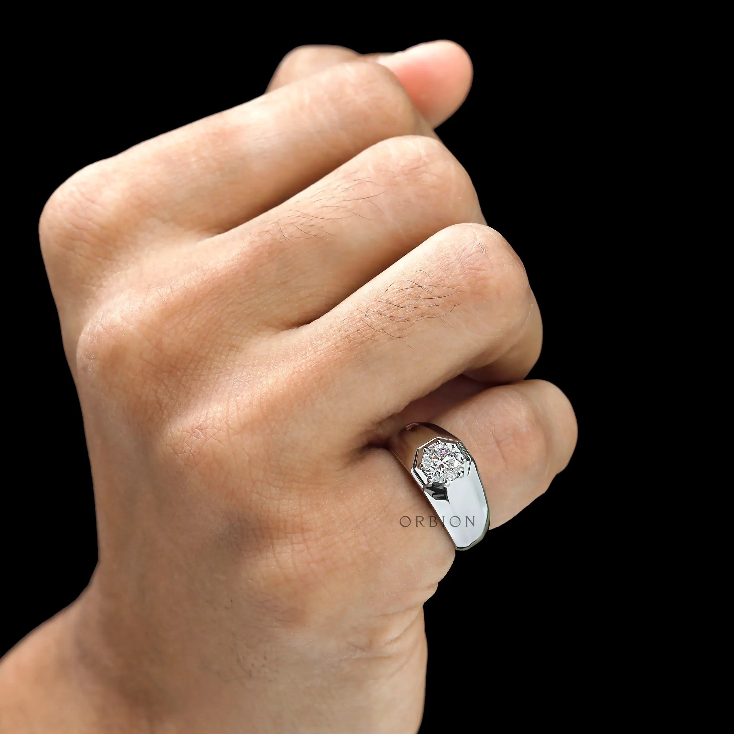 Men’s platinum signet ring with 1 CT lab diamond on finger