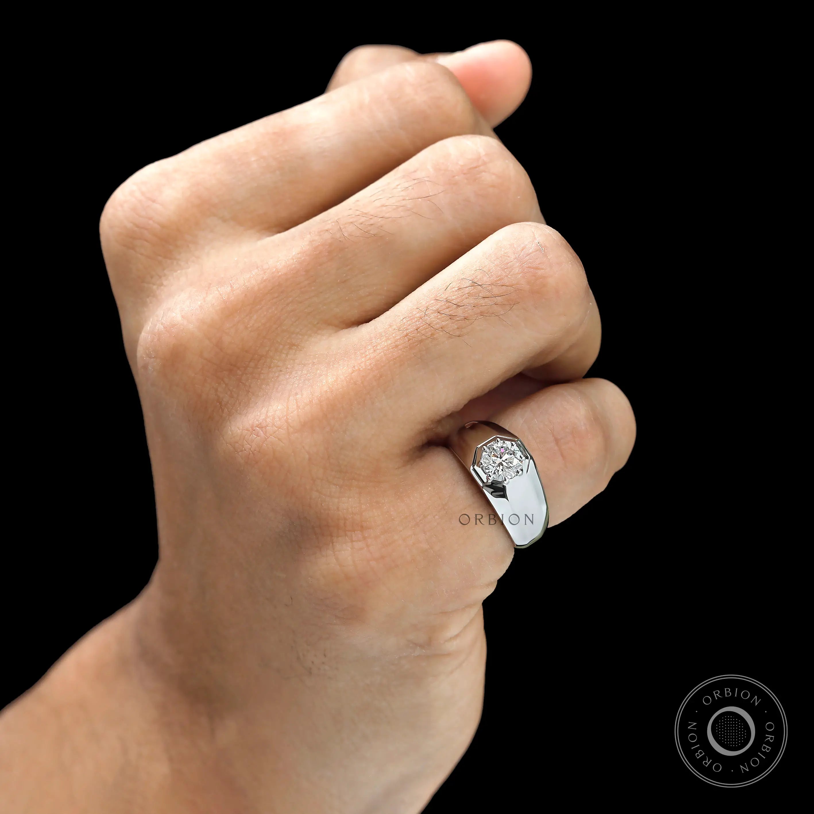 Men’s platinum signet ring with 1 CT lab diamond on finger