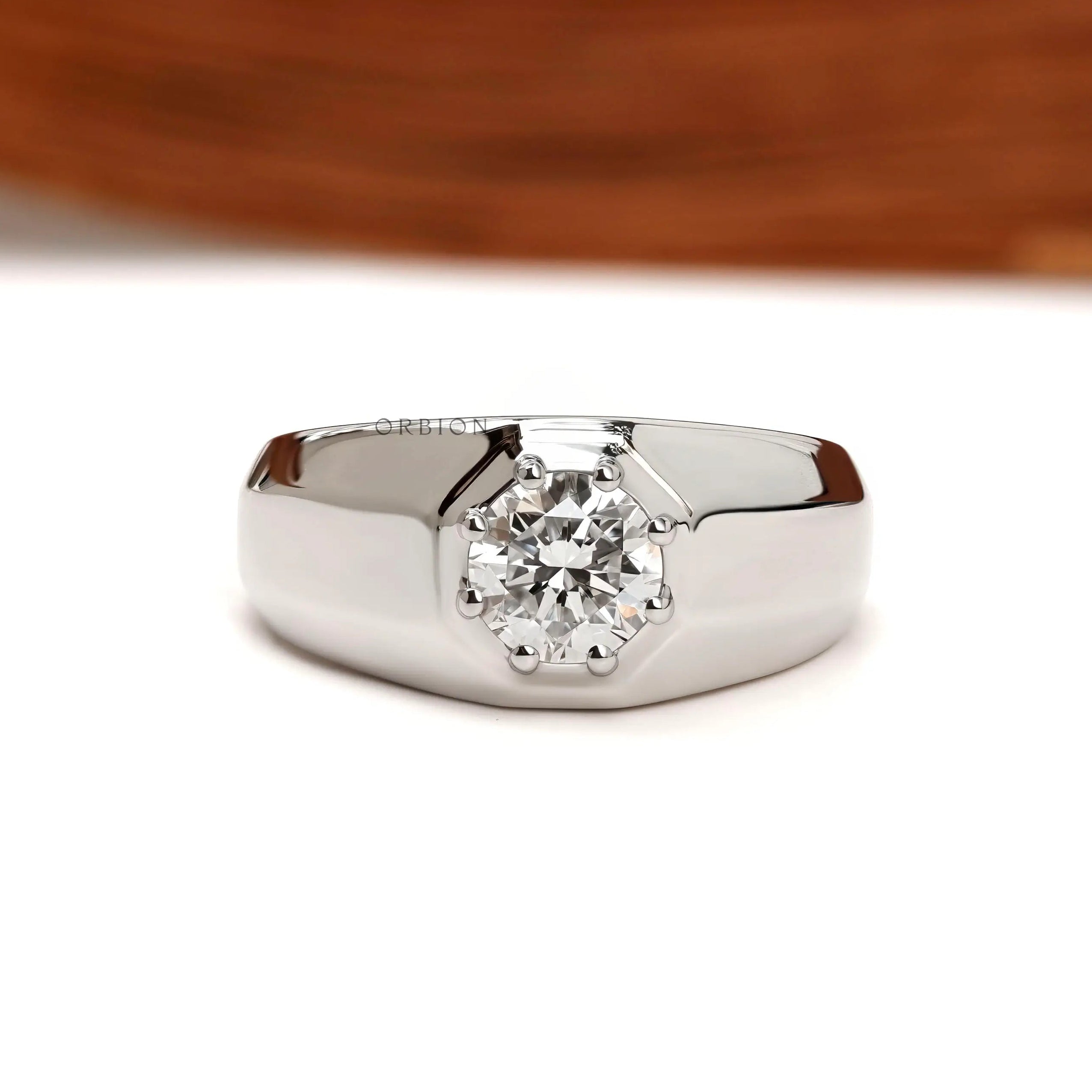 Chunky men’s diamond signet ring with tapered shank in platinum
