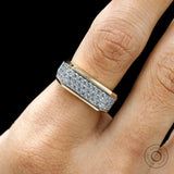 Close-up of pavé diamond setting on men’s yellow gold ring