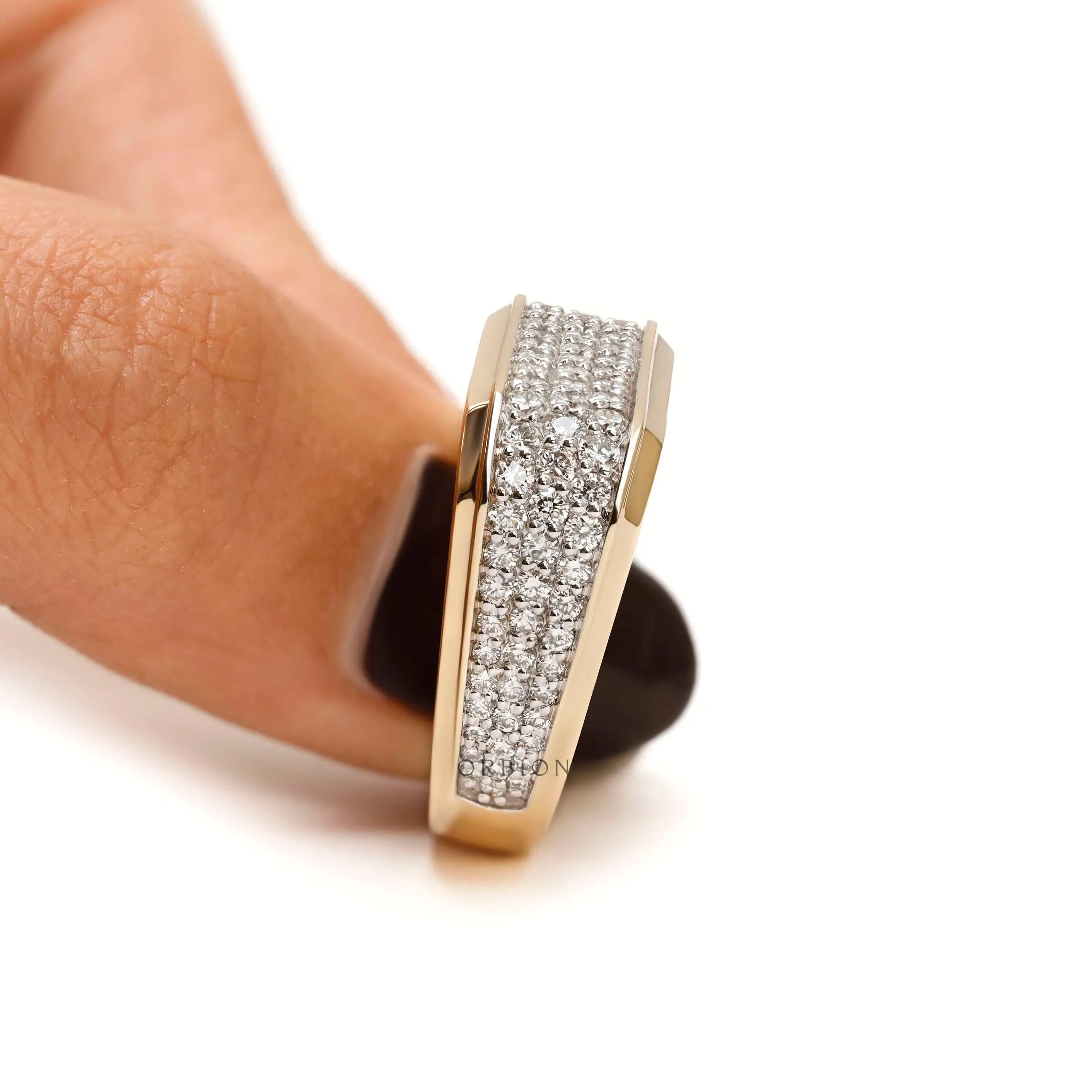 Detailed craftsmanship of pavé-set diamonds in men’s ring