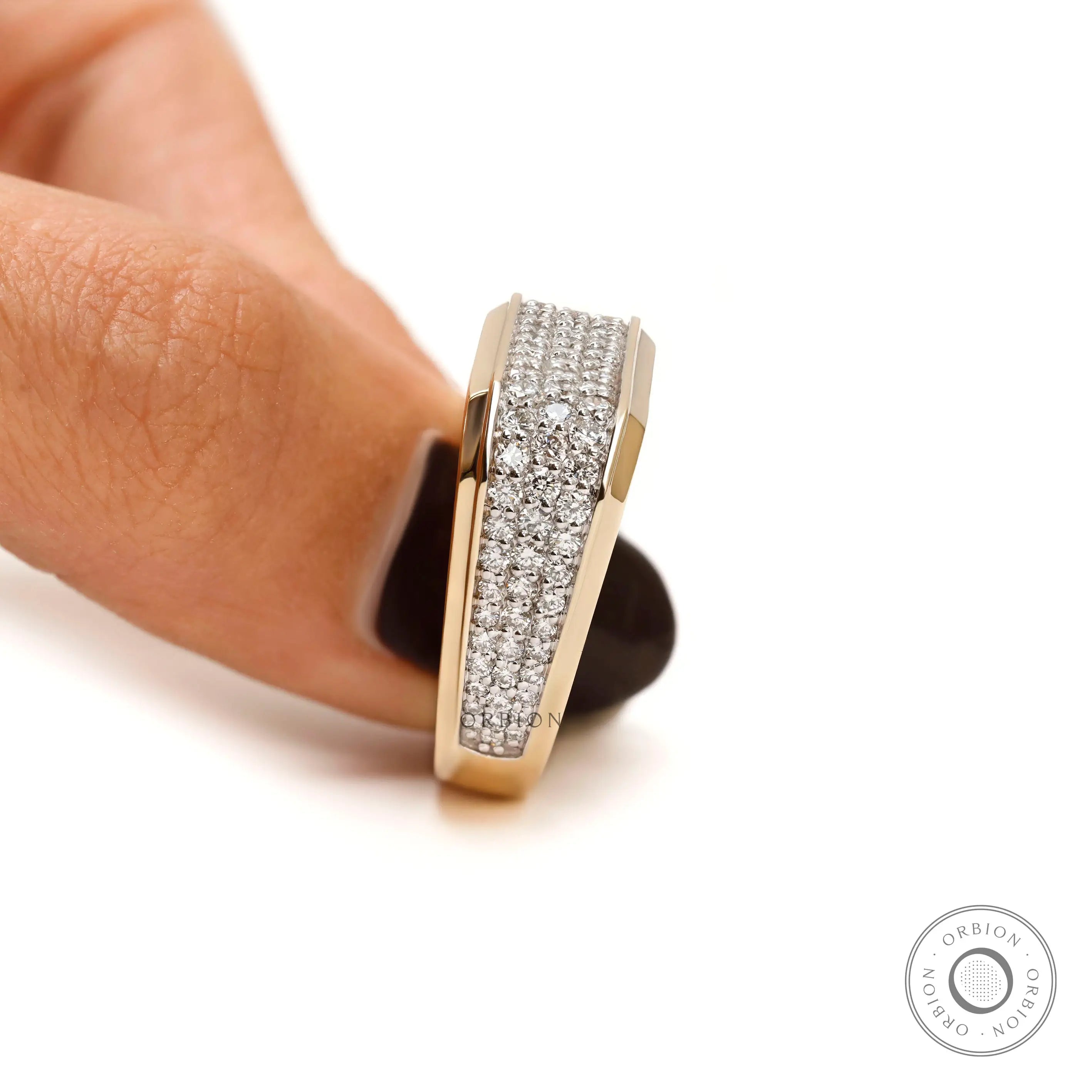 Detailed craftsmanship of pavé-set diamonds in men’s ring