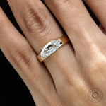 East west set old mine cut moval engagement ring on hand