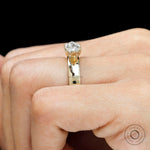 Unique antique style engagement ring with moval cut center stone