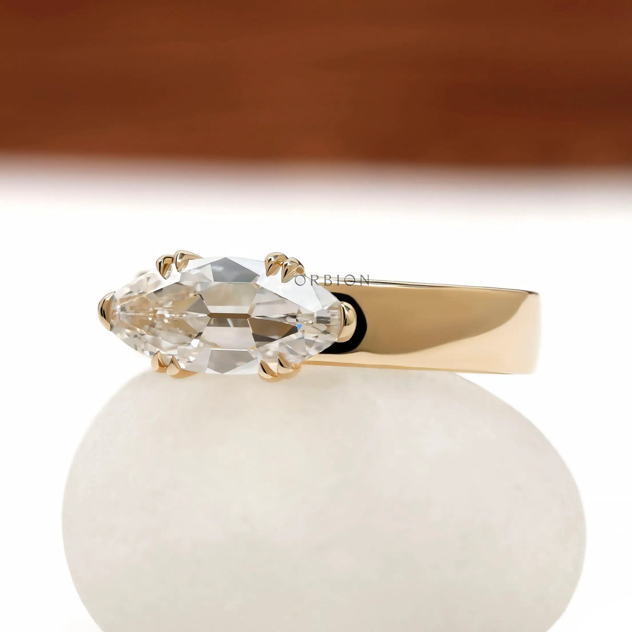 Thick band signet engagement ring with moval center stone