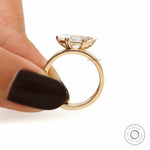Bold signet style engagement ring with moval cut stone