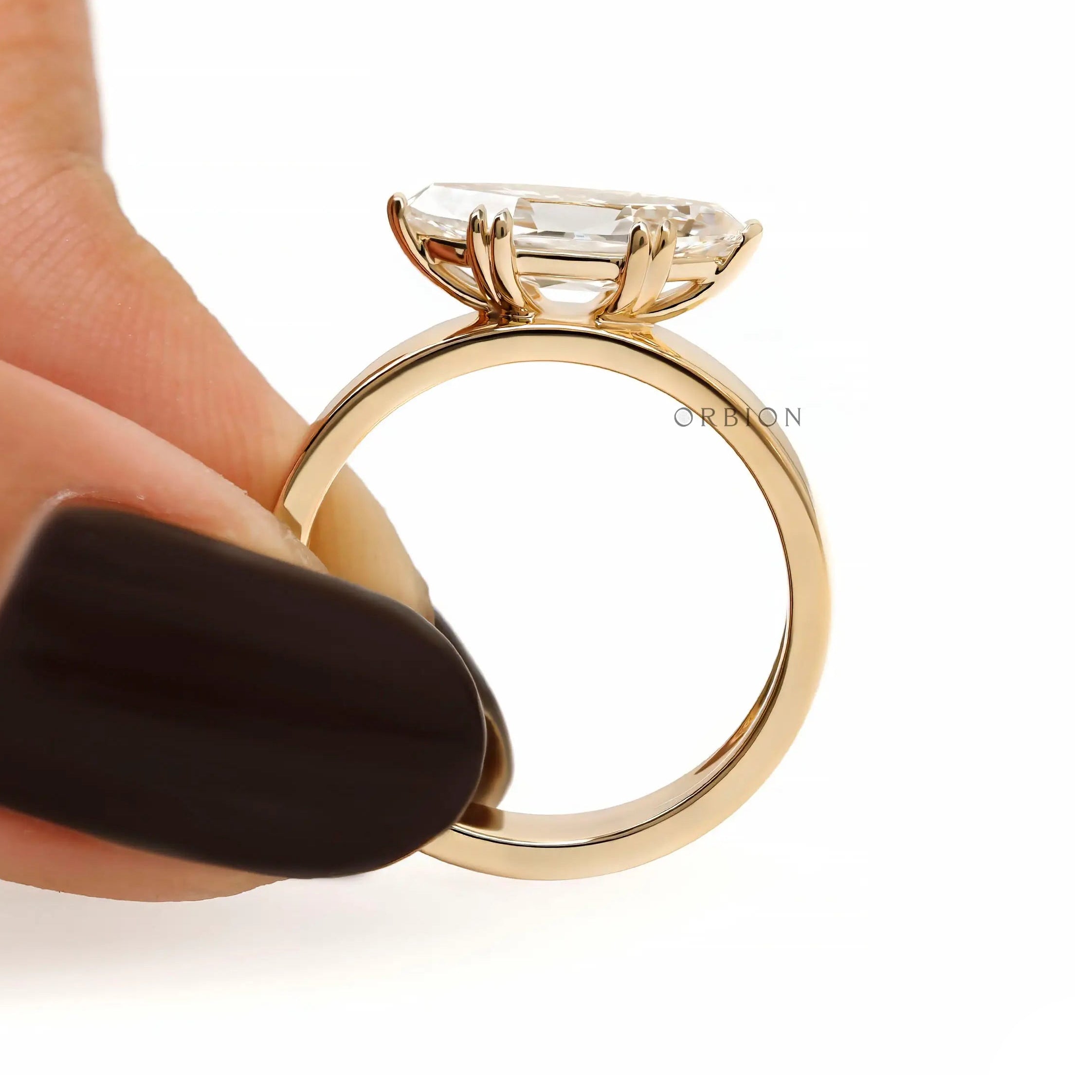 Bold signet style engagement ring with moval cut stone