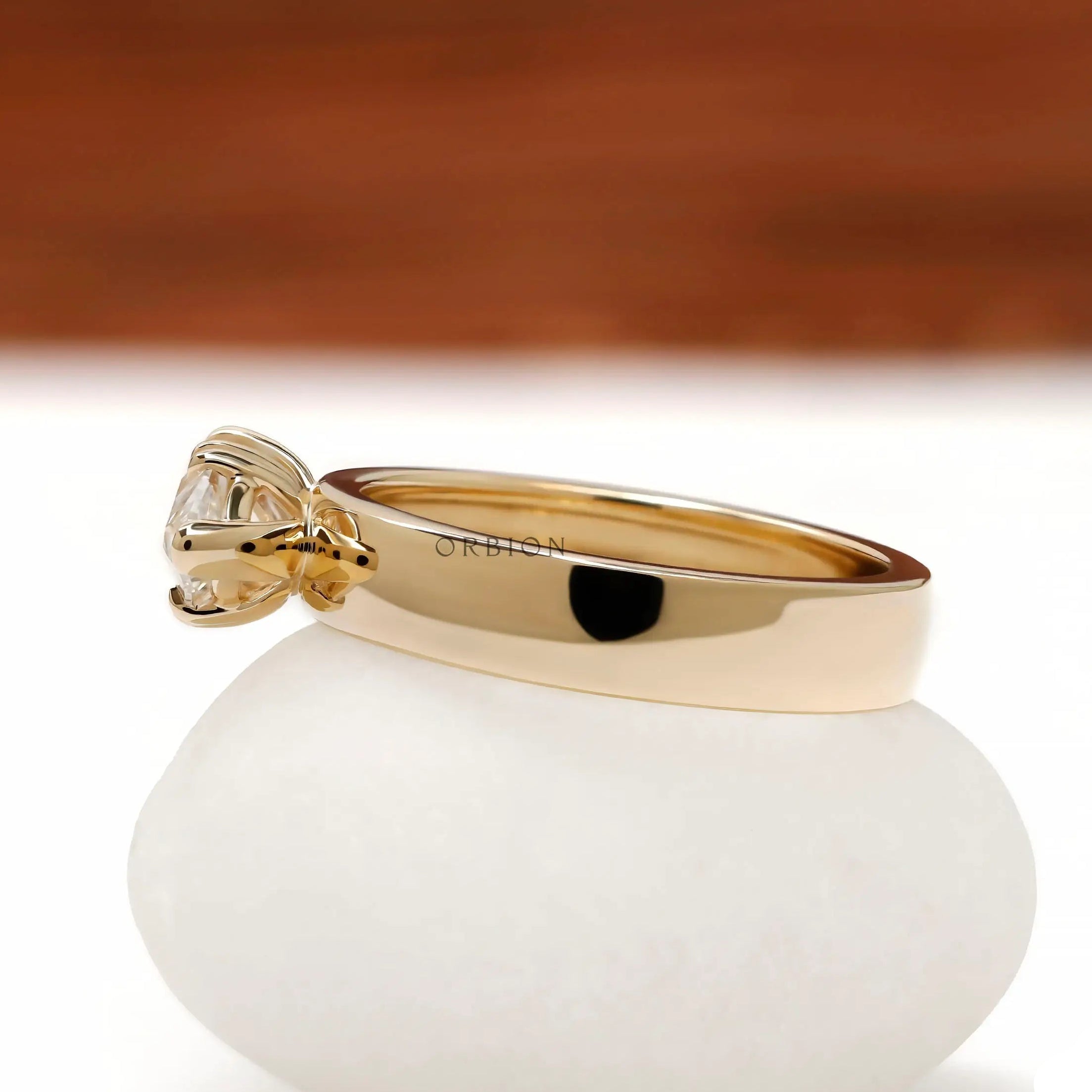 Side profile of east west moval cut signet ring