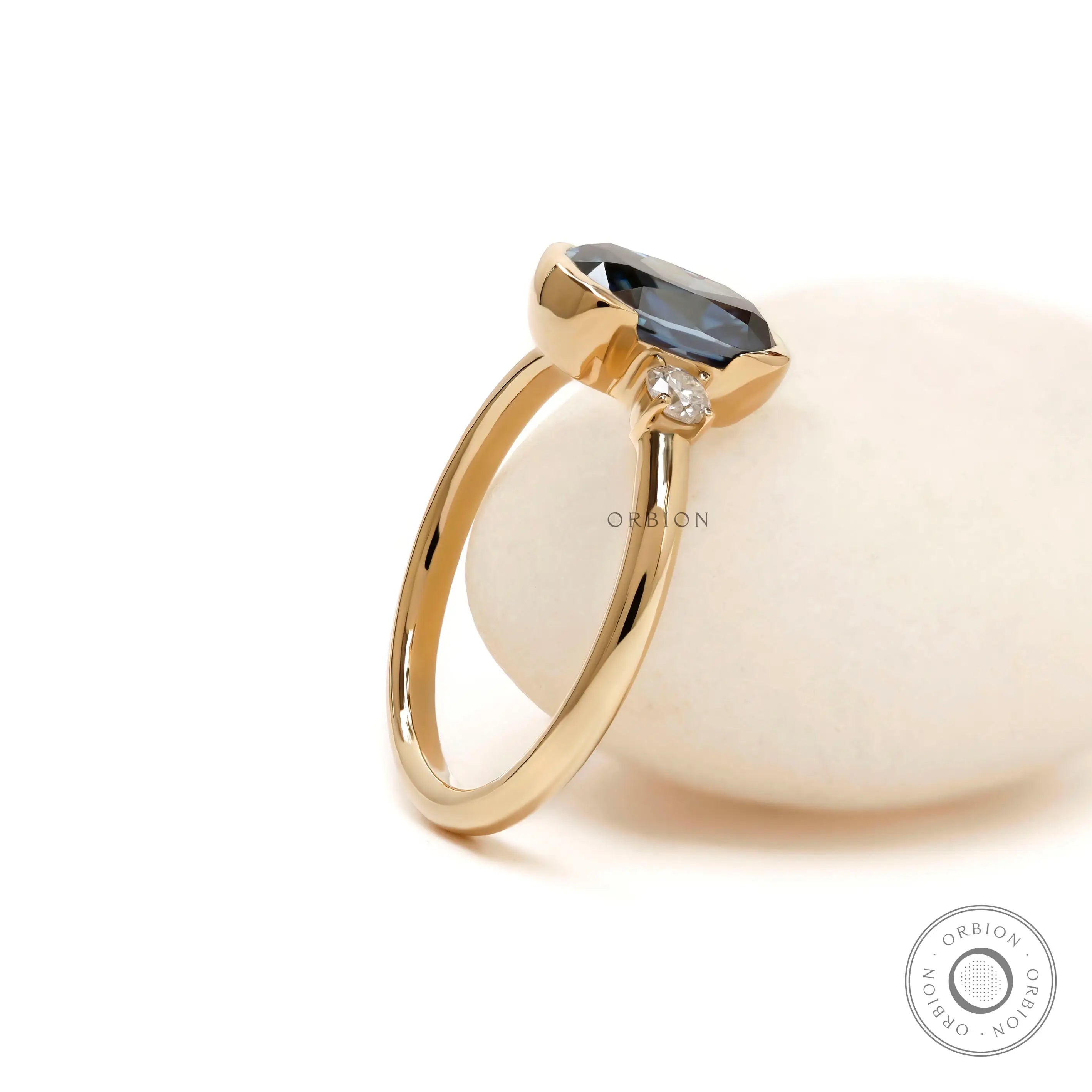 Elegant three stone colored moissanite engagement ring