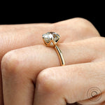 Classic antique inspired round diamond solitaire ring hand shot