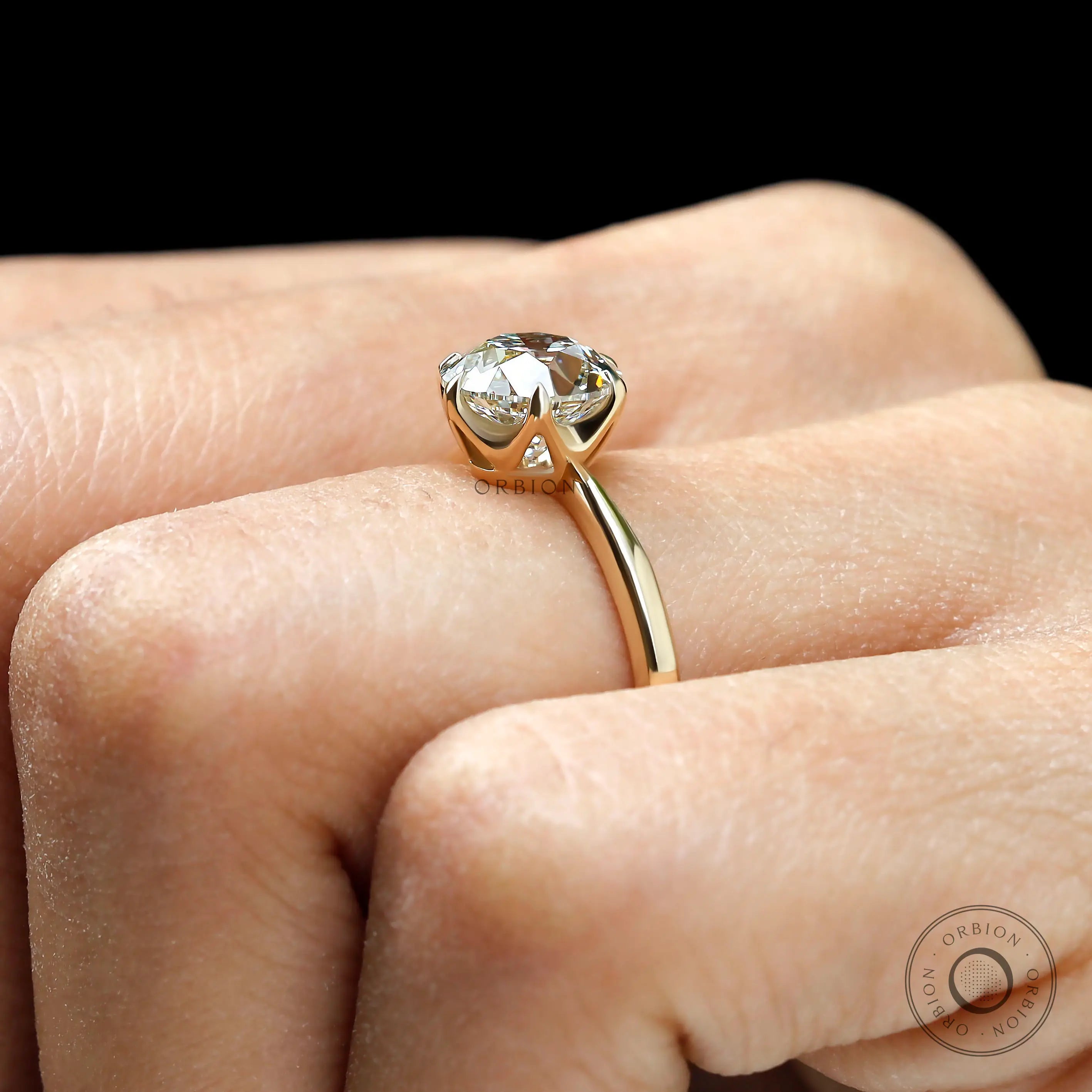 Classic antique inspired round diamond solitaire ring hand shot