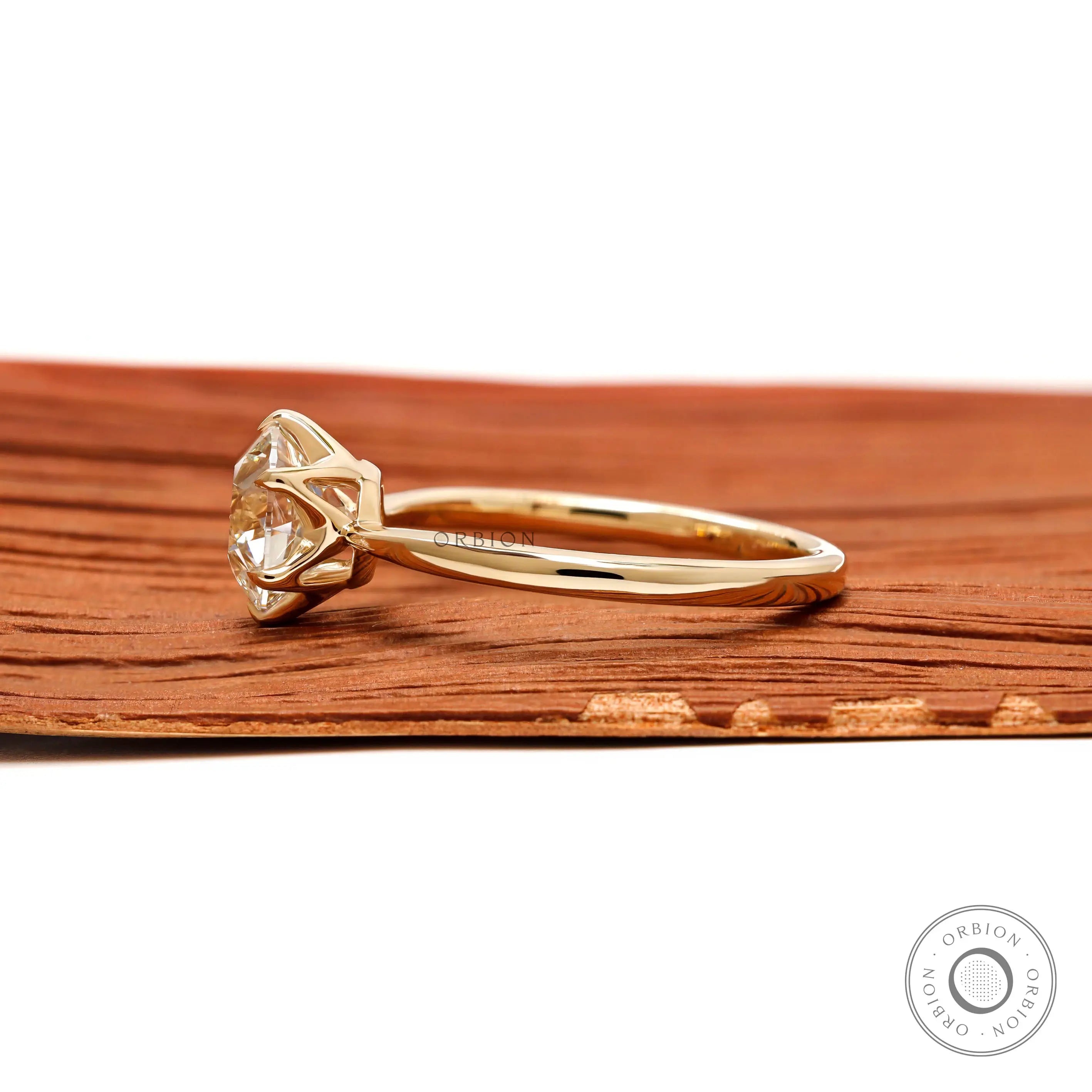 Elevated crown setting yellow gold vintage style solitaire ring