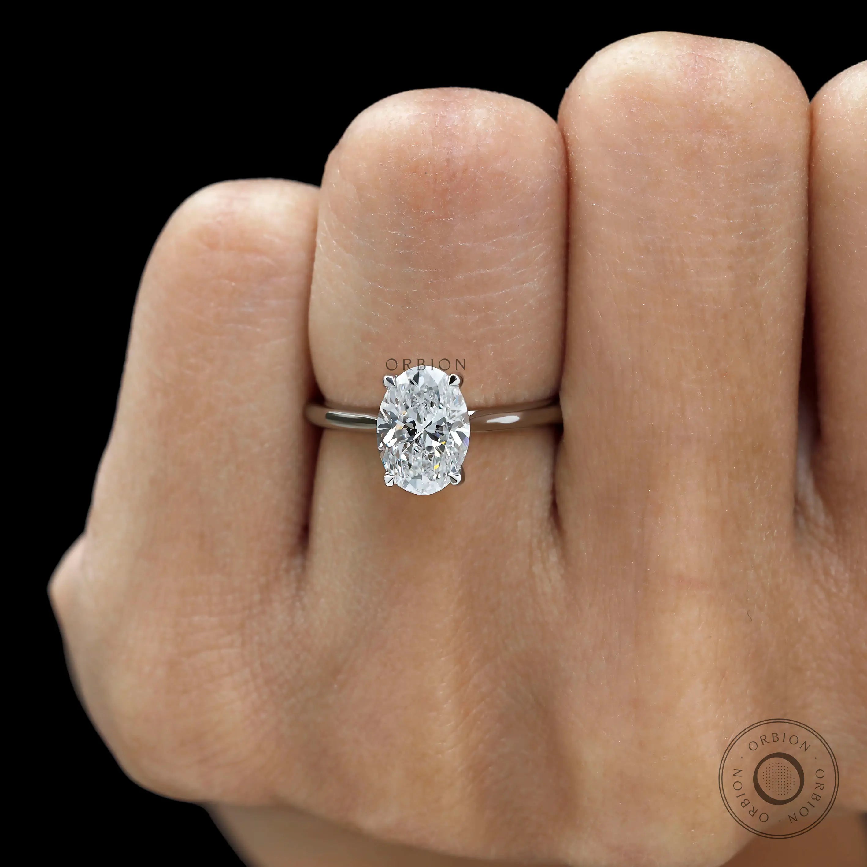 Oval cut lab grown diamond hidden halo cathedral engagement ring in white gold