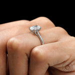 Classic cathedral engagement ring with hidden halo