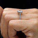 Minimalist oval diamond hidden halo engagement ring