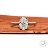 Oval moissanite engagement ring with round accent stones