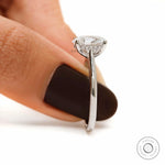 Slim band oval engagement ring with accent diamonds