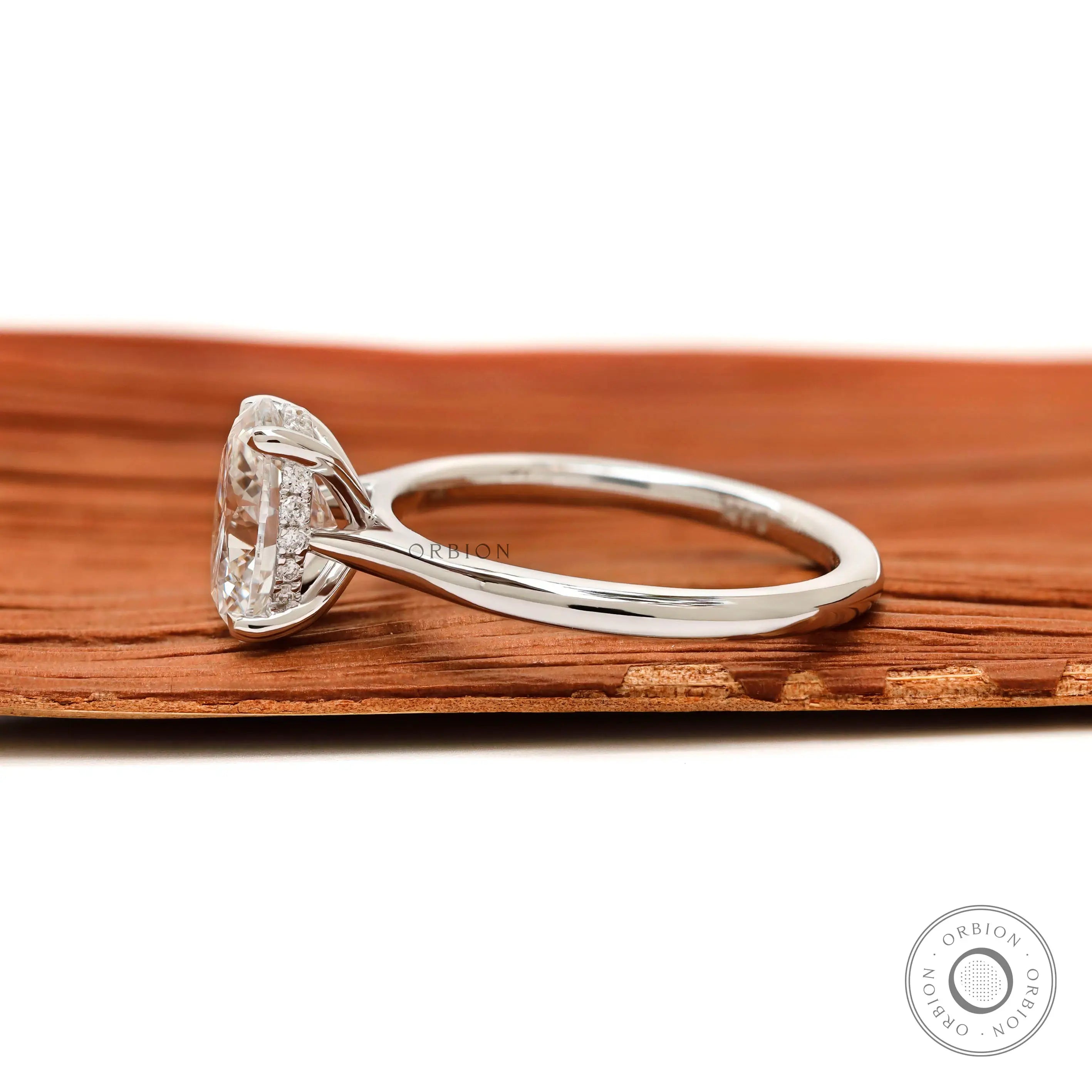 Hidden halo detail beneath oval center stone